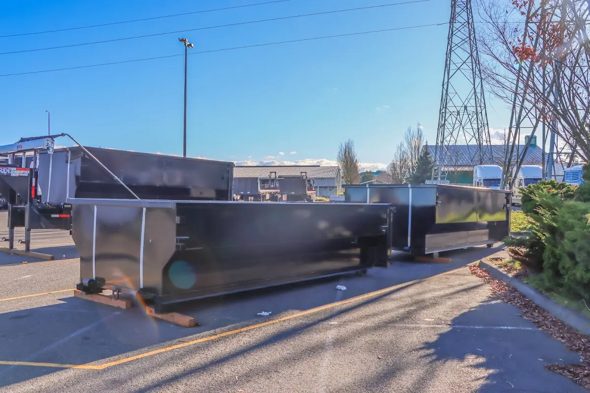 Roll-off dumpster ready for waste disposal at job site for 2 Yard Dumpster Rental in Bedford